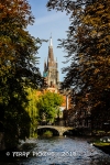 Bruges canal and cathedral beyond